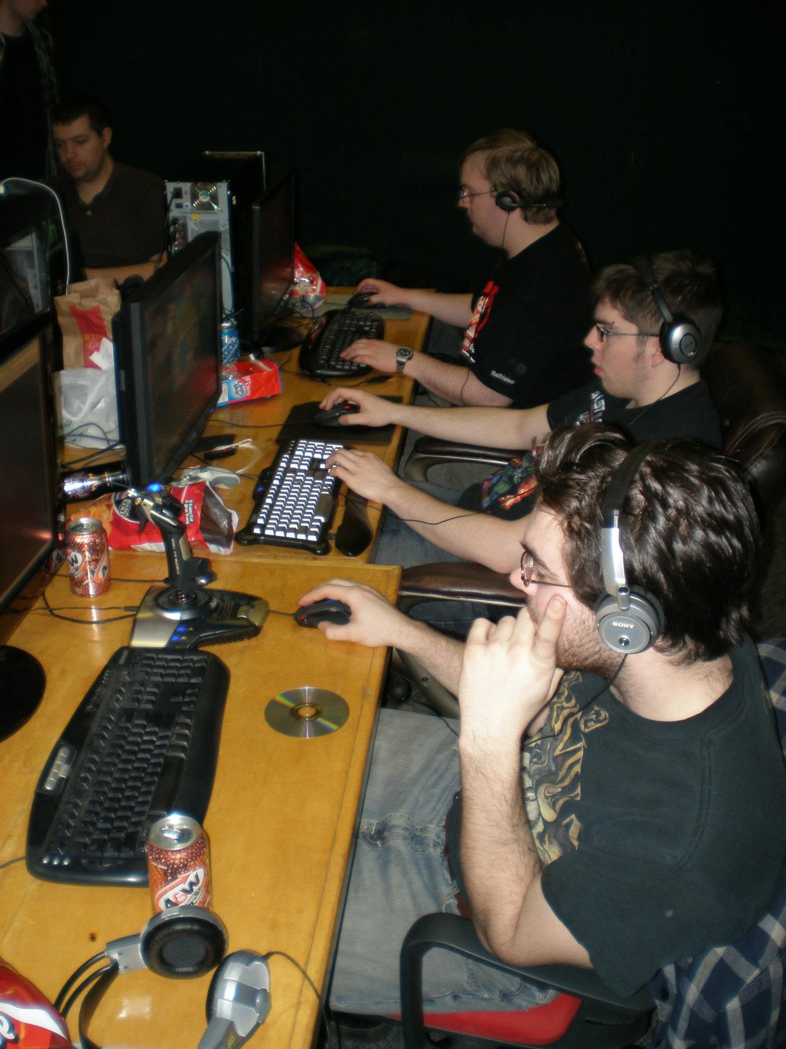 Earlier MegaFPS attendees playing together at a table of PCs