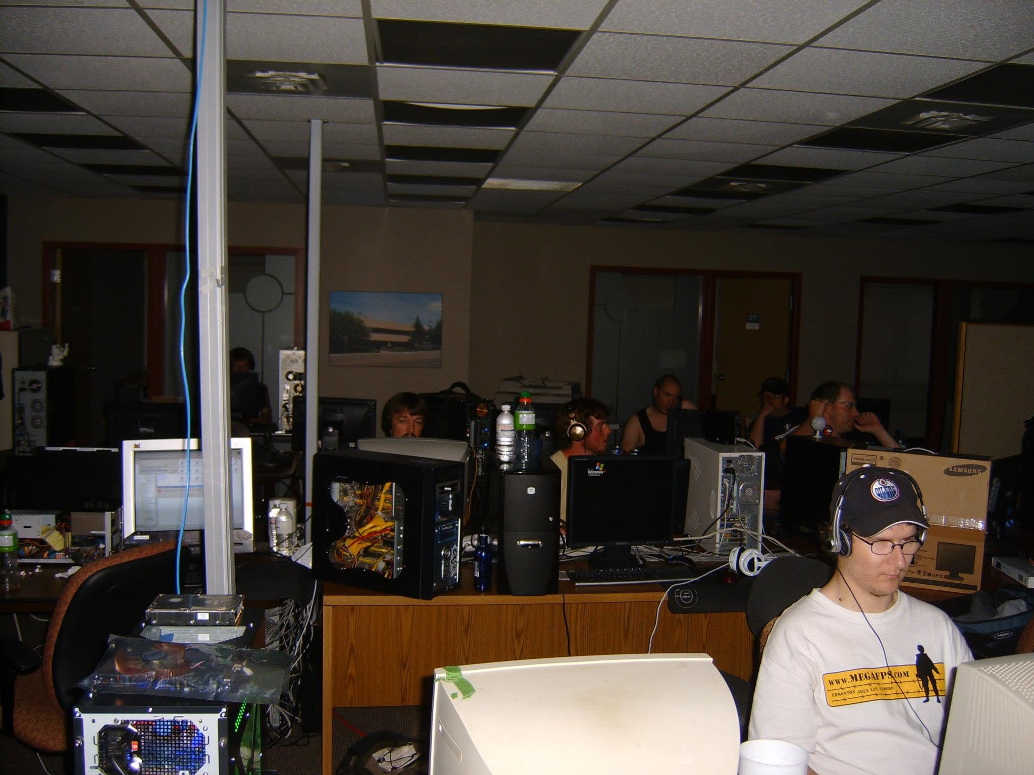 Earlier MegaFPS attendees gaming at a row of desktop computers